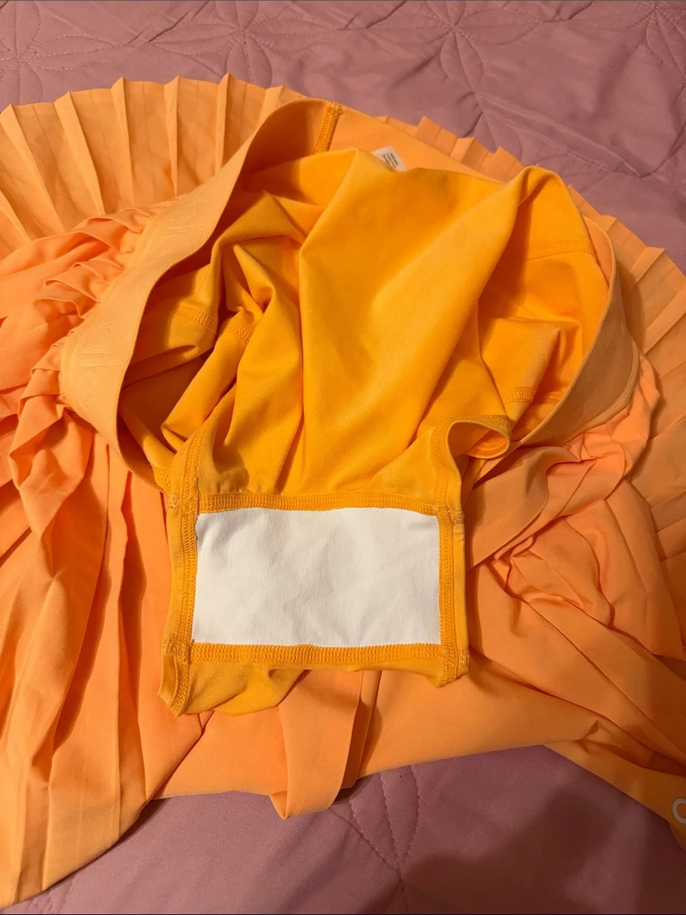 ALO Yoga Women’s Neon Orange Pleated Skirt